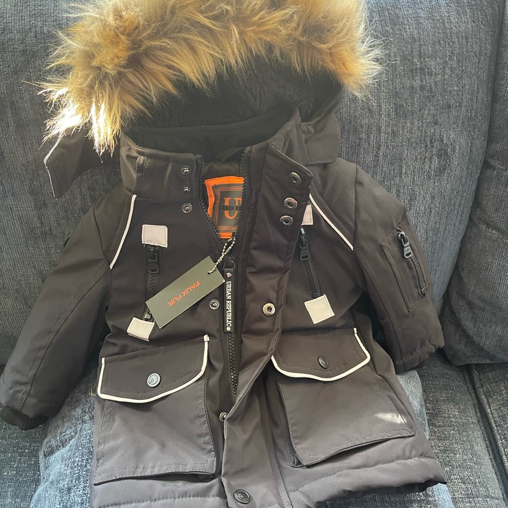 Brand New black toddler coat with fur sound the good . Size 18M